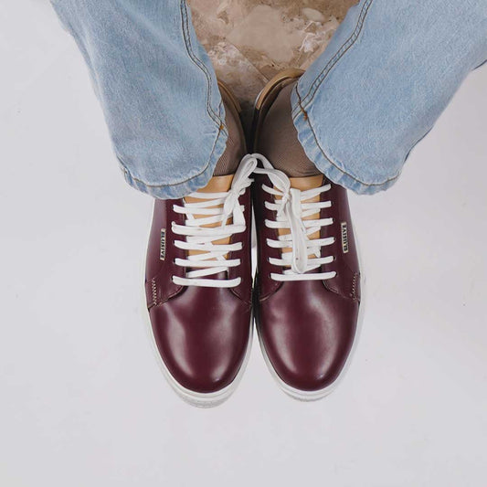 Elegant burgundy sneakers with a sleek design and TPR sole.