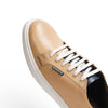 Elegant beige sneakers designed for versatility and refined style.