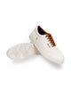 Raphael's white sneakers featuring timeless elegance and padded collars.