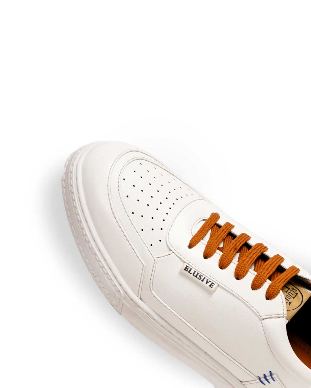 Raphael's white sneakers featuring timeless elegance and padded collars.